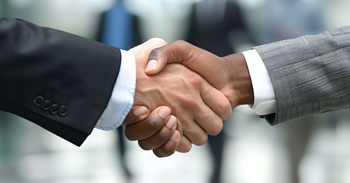 Close-up handshake symbolizing trusted IT outsourcing partnership with Mexico.