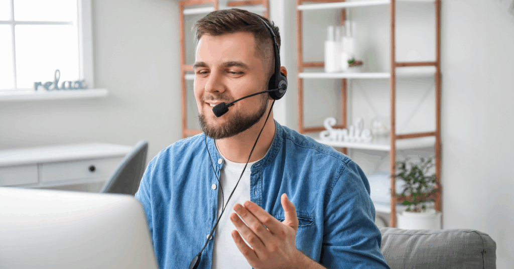 Colombian remote developer in headset having a virtual meeting from home.