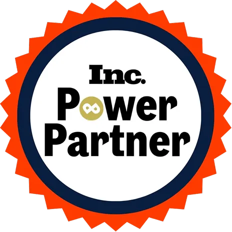 parallelstaff- A circular badge with a red jagged edge, a dark blue ring, and white center. The text Inc. Power Partner appears in bold black font, with an infinity symbol replacing the o in Power.