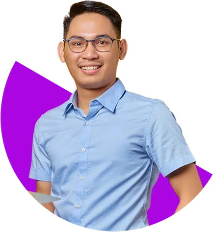 parallelstaff- A smiling person wearing glasses and a light blue button-up shirt stands in front of a purple geometric background shape.