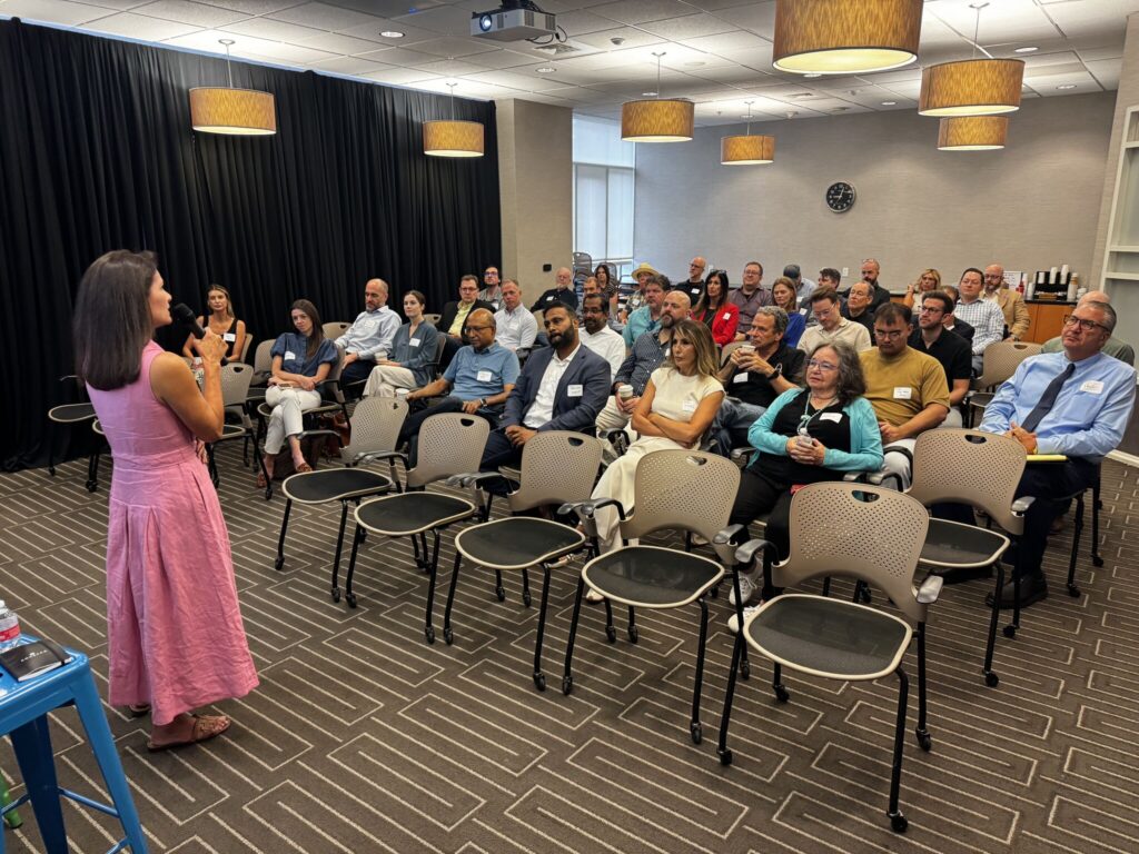 Austin technology professionals listening to Rita Keller during the September Austin Technology Council Roundtable Breakfast.